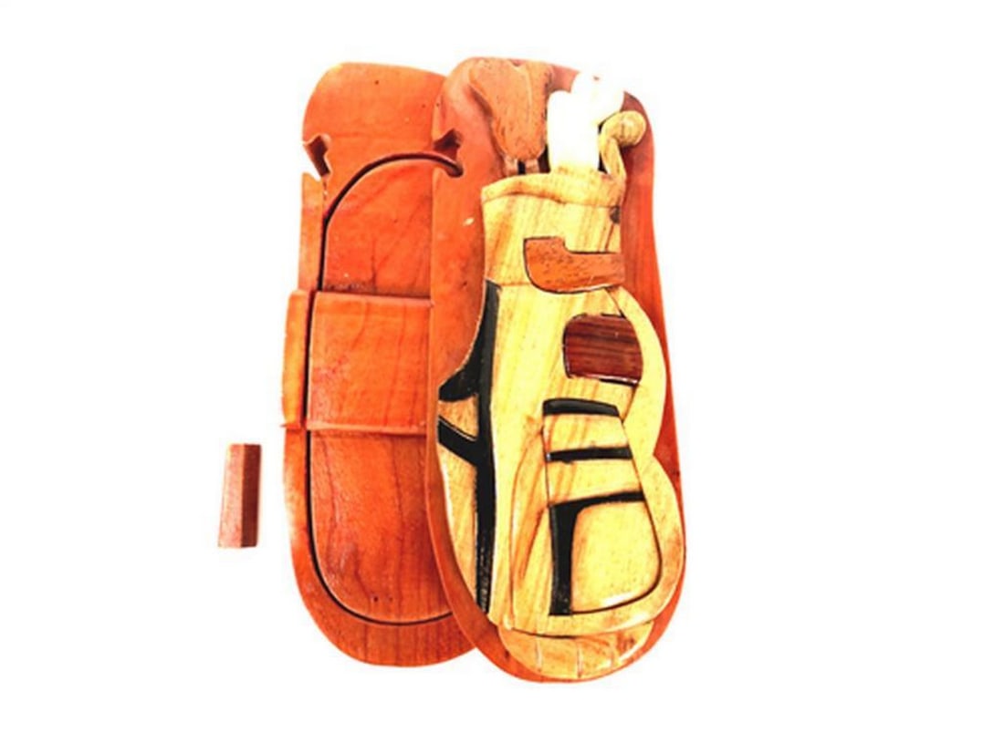 Mahogany Golf Set Keepsake Box: Mahogany Golf Set Keepsake Box This keepsake box is hand-carved from mahogany wood and features a golf set design on the exterior, with a red velvet-lined interior for storing small items. The box