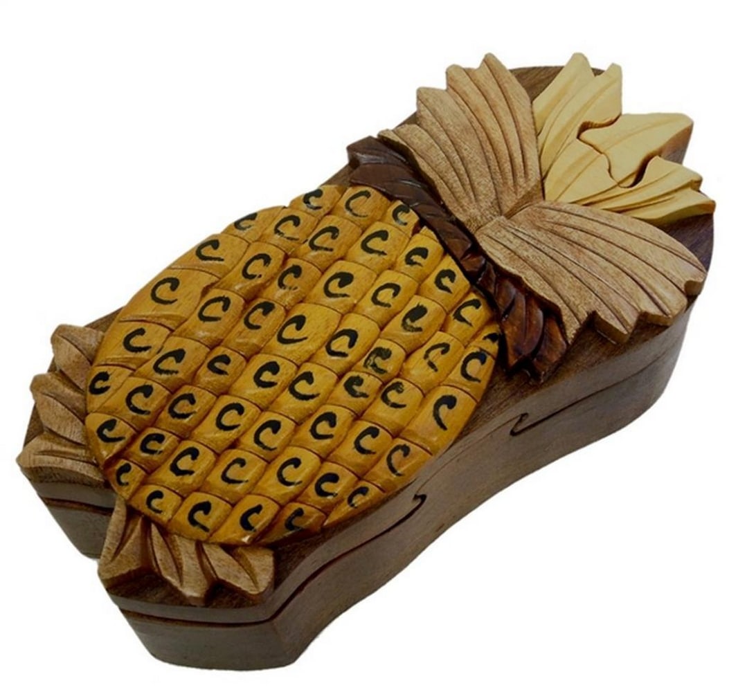 Mahogany Pineapple Keepsake Box: Mahogany Pineapple Keepsake Box This keepsake box is hand-carved from mahogany wood and features a pineapple design on the exterior, with a red velvet-lined interior for storing small items. The box