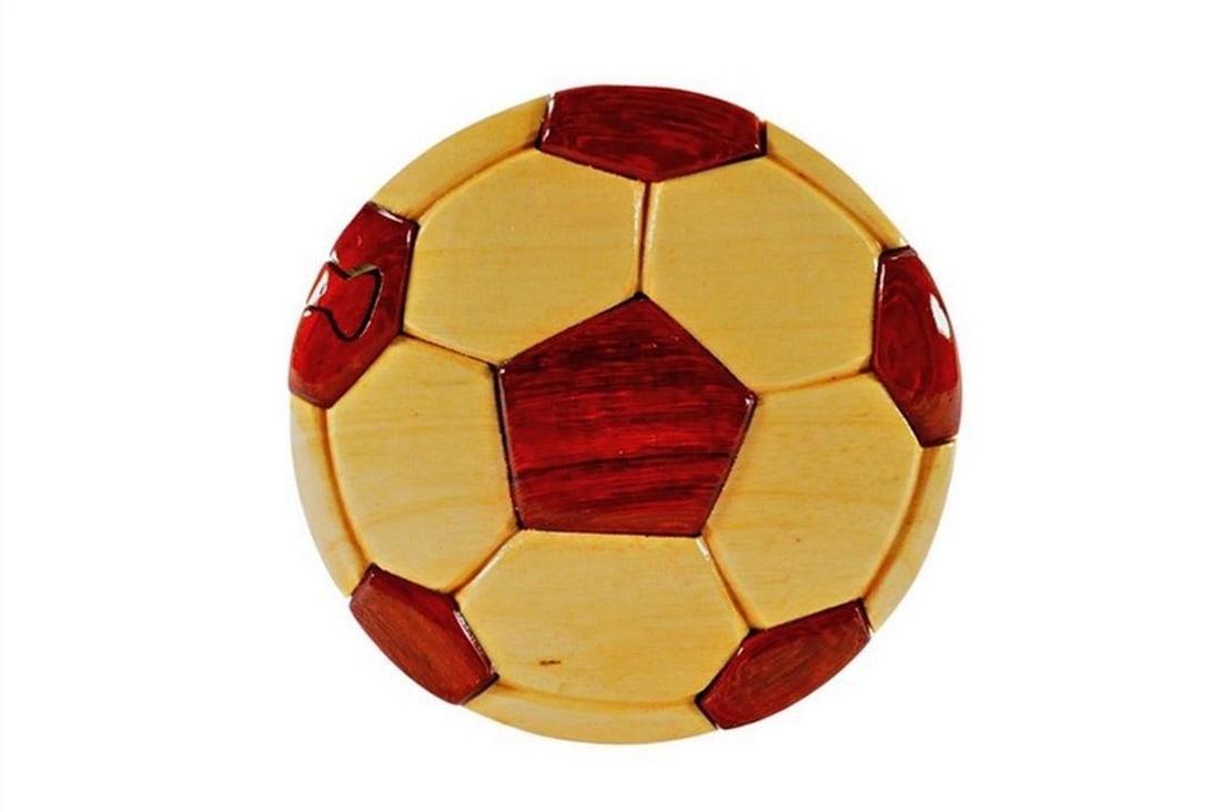 Mahogany Soccer Keepsake Box: Mahogany Soccer Keepsake Box This keepsake box is hand-crafted from Philippines mahogany and features a soccer design on the exterior, with a red velvet-lined interior for storing small items. The