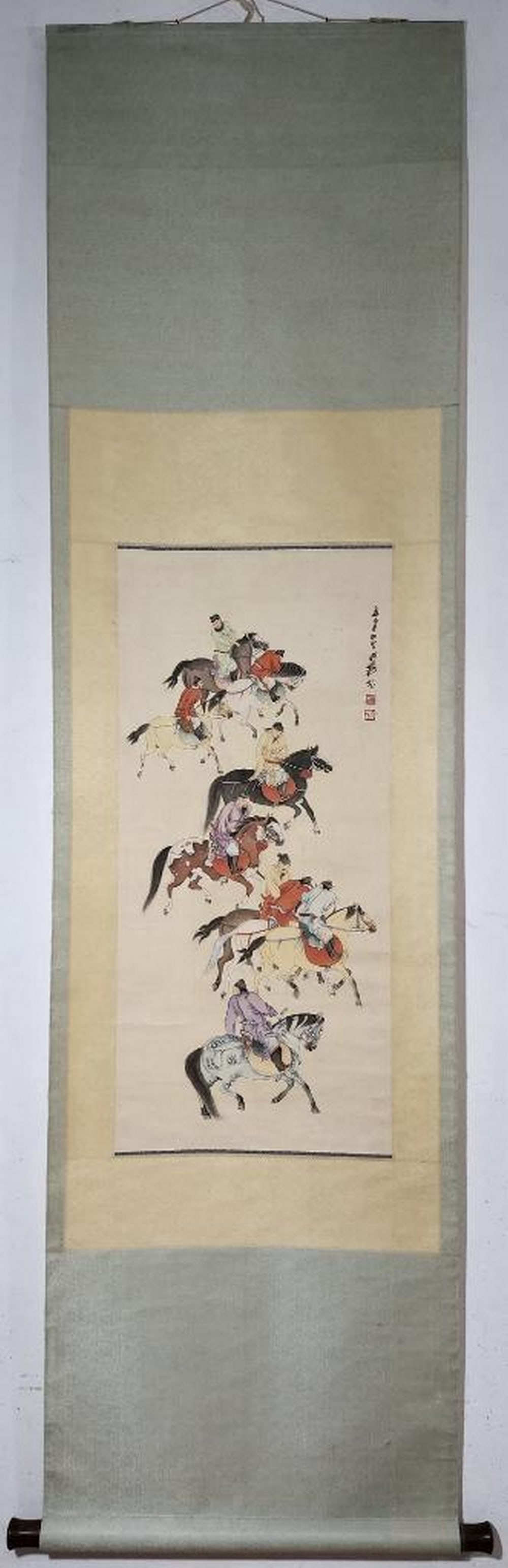 Inspired Chinese Brush Handpainting on Paper Scroll Bearing the Mark of Zhang Daqian: Inspired Chinese Brush Handpainting on Paper Scroll Bearing the Mark of Zhang Daqian This vibrant Chinese brush painting captures a spirited group of horses and riders in motion, rendered with express