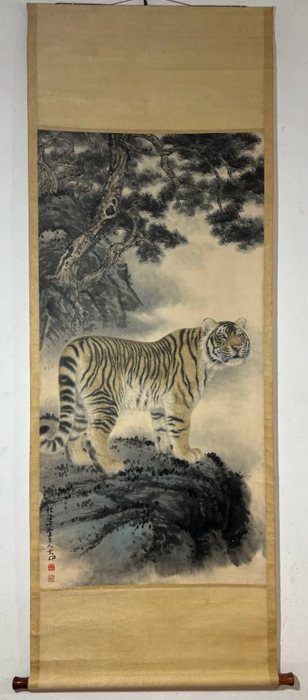 Inspired Chinese Brush Handpainting on Paper Scroll Bearing the Mark of Feng Dazhong: Inspired Chinese Brush Handpainting on Paper Scroll Bearing the Mark of Feng Dazhong This striking Chinese brush painting portrays a majestic tiger poised on a rocky outcrop, framed by mist and ancien