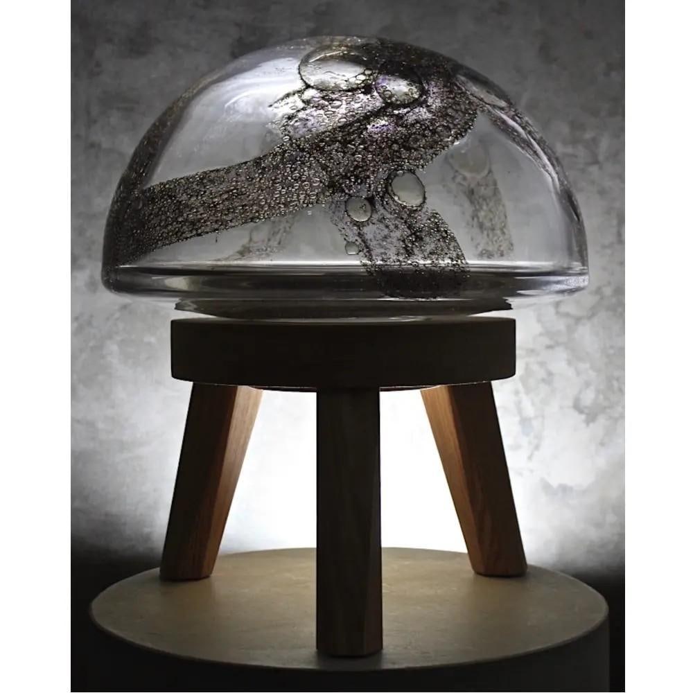 "U.F.O." Unique Art Glass by Jan Falta: "U.F.O."Unique Art Glass by Jan Falta U.F.O. is a distinctive art glass sculpture, elegantly supported on its own tripod. The superior quality glass effortlessly captures and reflects light, a