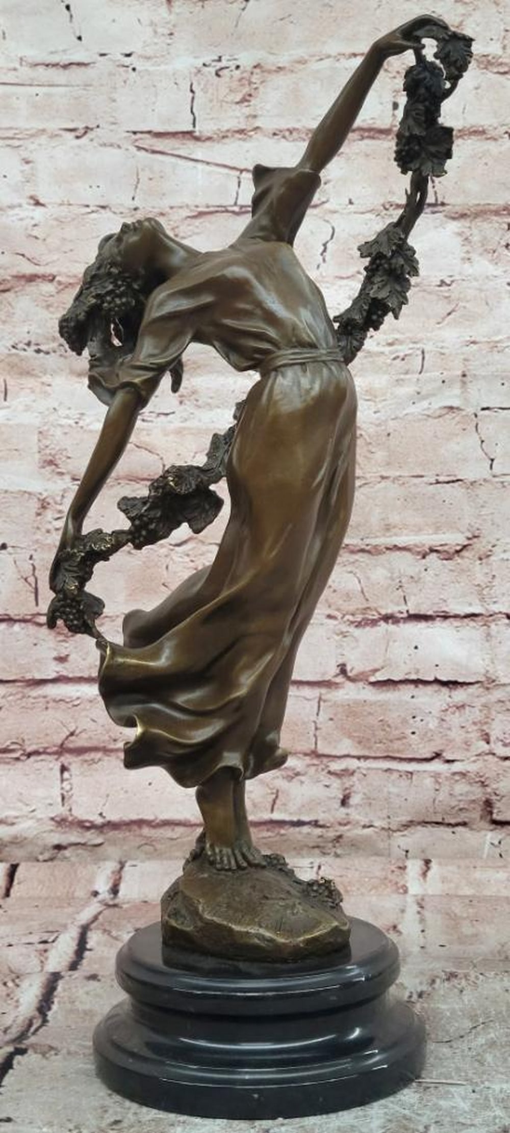 Vine Garland Female Figure Bronze Sculpture after Pierre Collinet - 17" x 5": Vine Garland Female Figure Bronze Sculpture after Pierre Collinet - 17" x 5" This bronze sculpture after Pierre Collinet captures the elegance of the female form adorned with a flowing vine ga