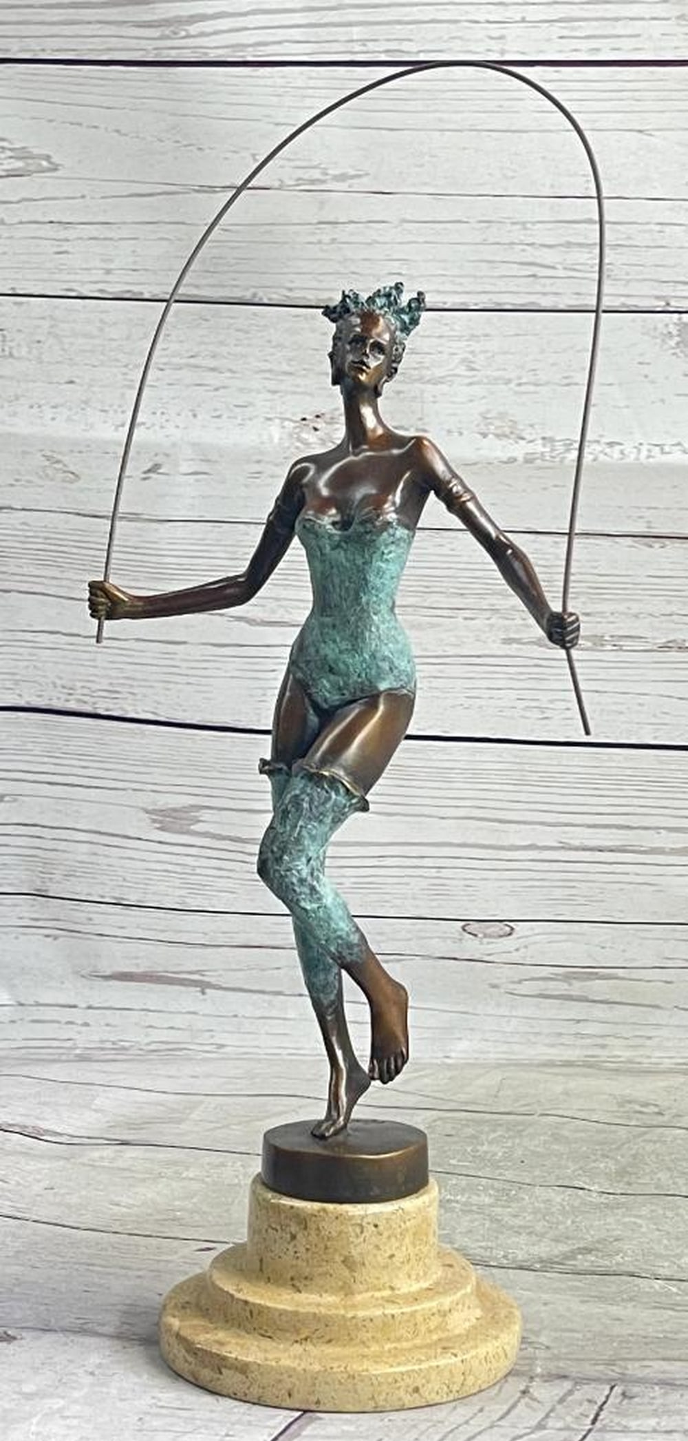 Milo Original Green Patina Jumping Rope Girl Bronze Sculpture: Milo Original Green Patina Jumping Rope Girl Bronze Sculpture Experience the mesmerizing performance of this bronze dancer as she effortlessly moves across the stage with grace and agility. With each 