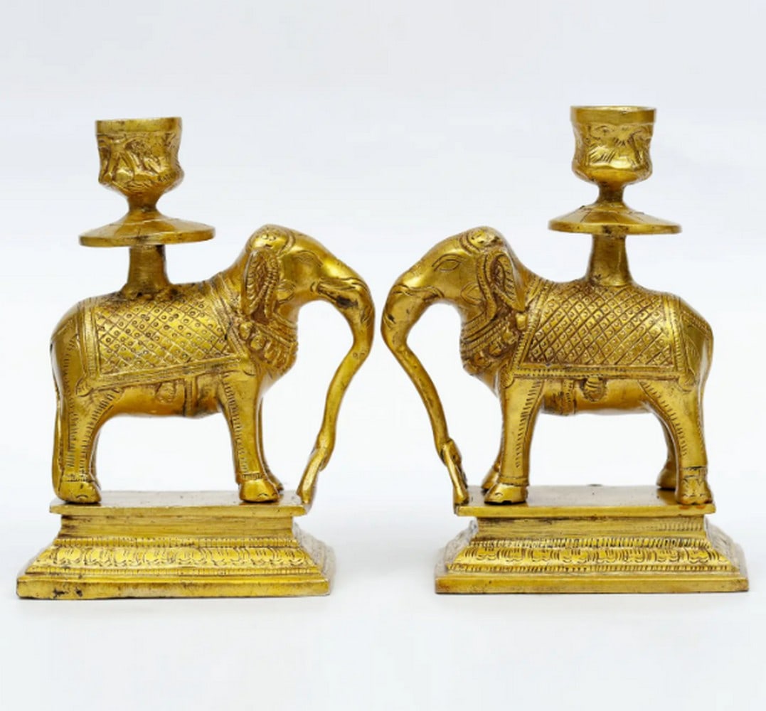 Brass Pair of Elephant Candle Holders - 6'': Brass Pair of Elephant Candle Holders - 6" A pair of 6.3-inch brass candle holders shaped as elephants. Each piece features smooth contours and detailed form, designed for tabletop display. Crafte