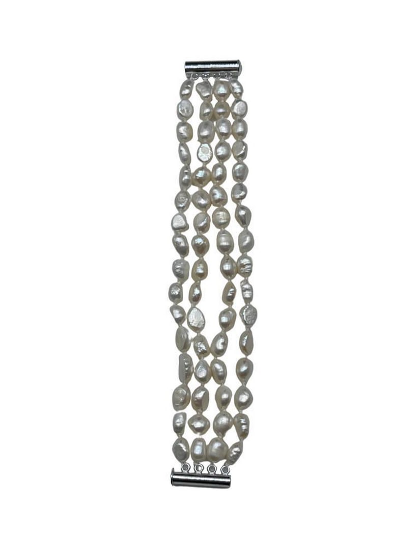 Natural White Baroque 4-Strand Freshwater Pearl Bracelet: Natural White Baroque 4-Strand Freshwater Pearl Bracelet. Natural Silver Glimmers Come Off Each Of The 7-8mm Pearls. There are 60+ Pearls On This 4 Strand Bracelet and Is Accompanied By A Push