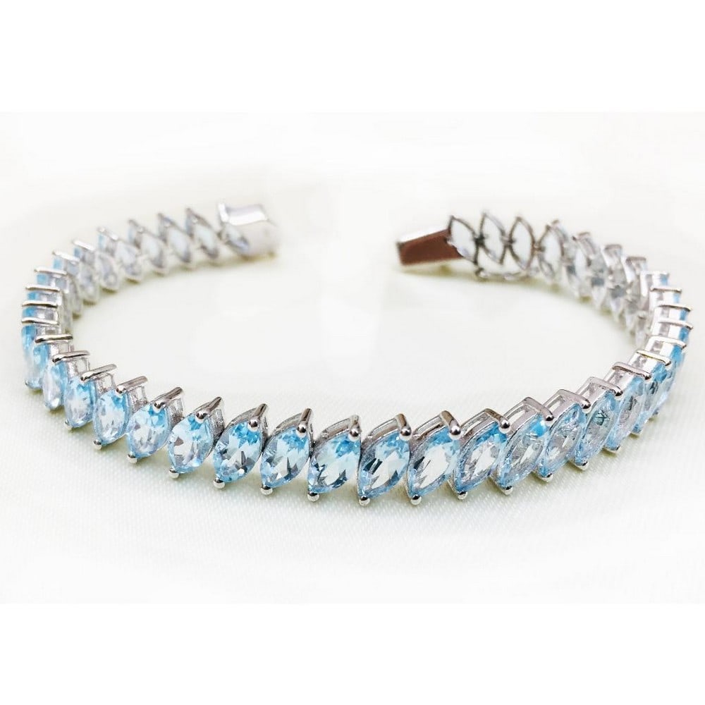 Blue Topaz Marquise Faceted Studded Bracelet: Blue Topaz Marquise Faceted Studded Bracelet Blue Topaz represents loyalty and righteousness, it is associated with true love. It is said to bring joy, generosity, abundance, and good health. Size of 