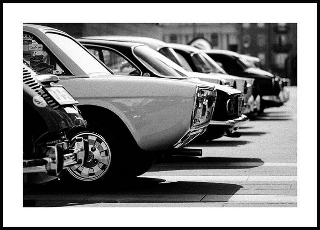 Vintage Classic Cars Monochromatic Poster Print: Vintage Classic Cars Monochromatic Poster Print Black and white retro print featuring classic cars. Designed with a printed white margin that frames the artwork. Frame NOT included Dimensions: 20"