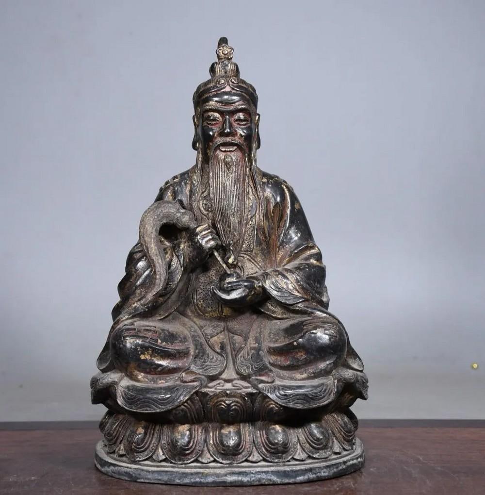 Gilded Copper Taishang Laojun Buddha Statue: Gilded Copper Taishang Laojun Buddha Statue This antique Taishang Laojun Buddha statue is a masterful work of traditional Chinese craftsmanship, meticulously handcrafted from pure copper and adorned w