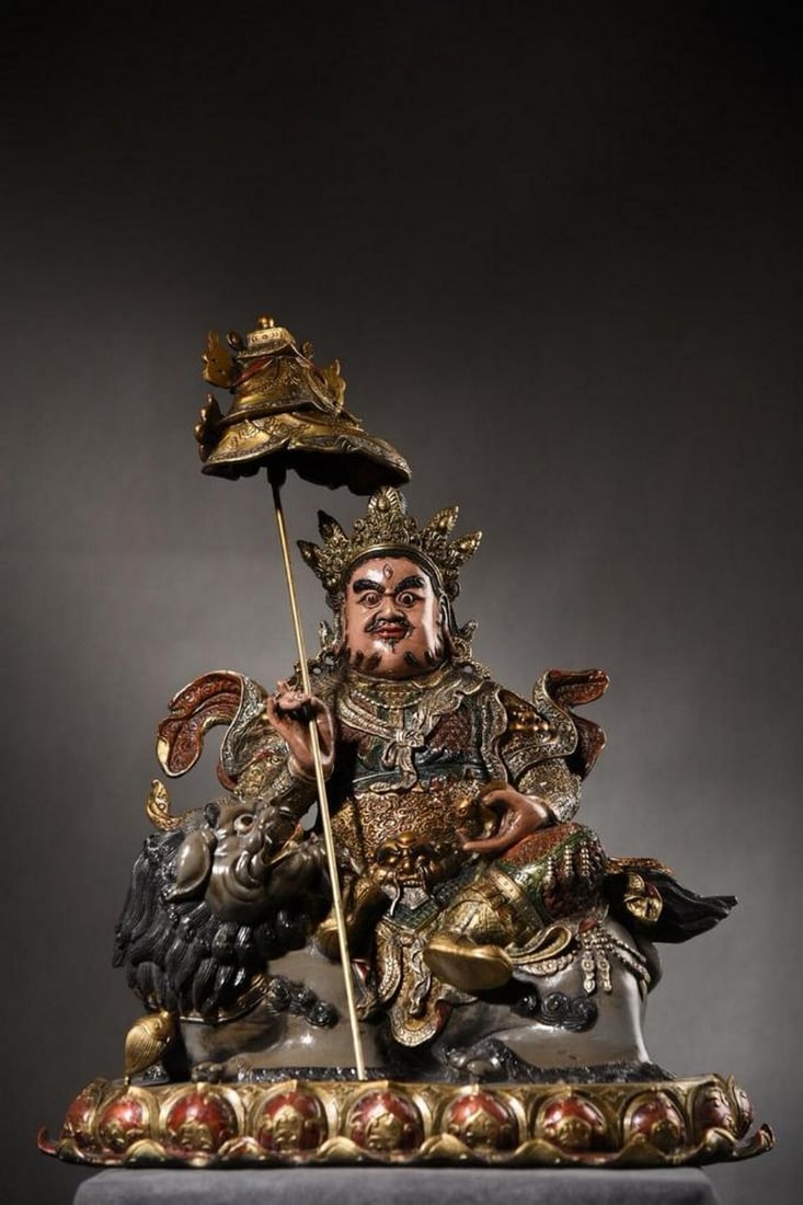 Handcrafted Gilded Copper Treasure King Buddha Statue: Handcrafted Gilded Copper Treasure King Buddha Statue This finely crafted antique Buddha statue embodies timeless artistry, meticulously hand-forged from pure copper and adorned with delicate gold