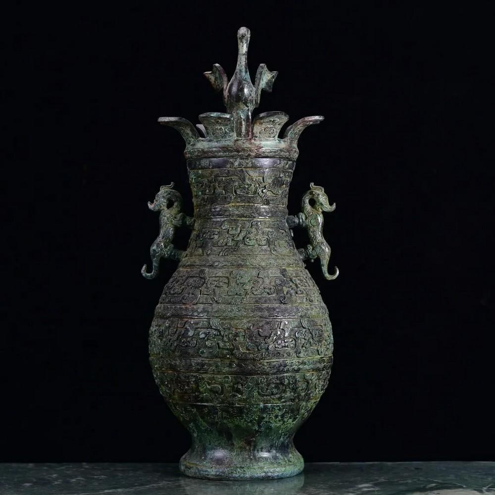 Antique Chinese Crane Inspired Bronze Vase Ornament: Antique Chinese Crane Inspired Bronze Vase Ornament This antique Chinese bronze vase ornament is inspired by the graceful form of the crane, a symbol of longevity and peace. The intricate detailing ca