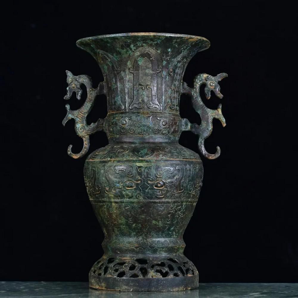 Chinese Handmade Bronze Inscribed Hollow Bottle Statue: Chinese Handmade Bronze Inscribed Hollow Bottle Statue This rare and meticulously handcrafted bronze hollow bottle statue is a masterpiece of ancient Chinese artistry. Adorned with intricate inscripti