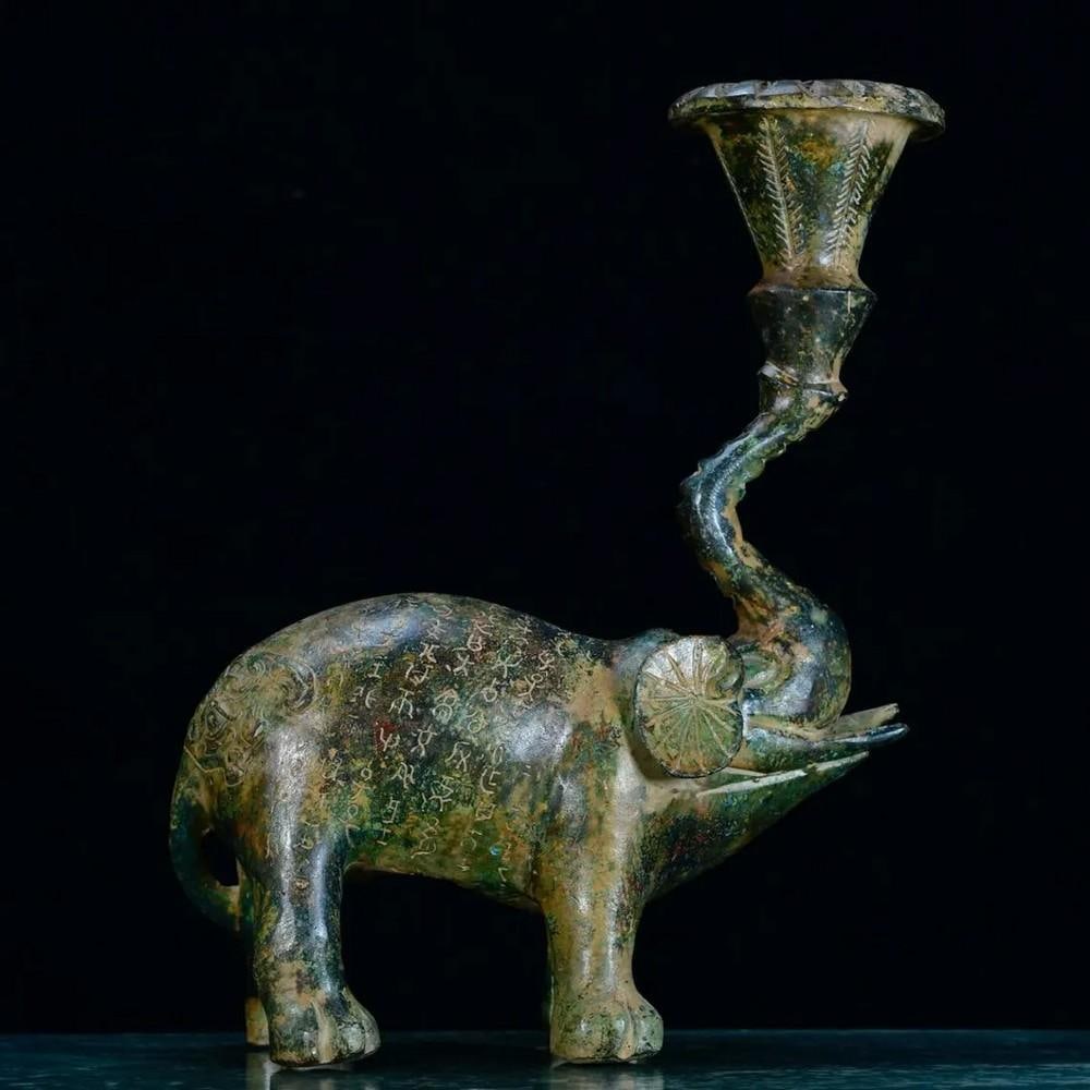 Chinese Handmade Bronze Elephant Lamp Statue: Chinese Handmade Bronze Elephant Lamp Statue This rare and exquisitely handcrafted bronze elephant lamp statue is a captivating fusion of artistry and functionality. The elephant, symbolizing wisdom, 