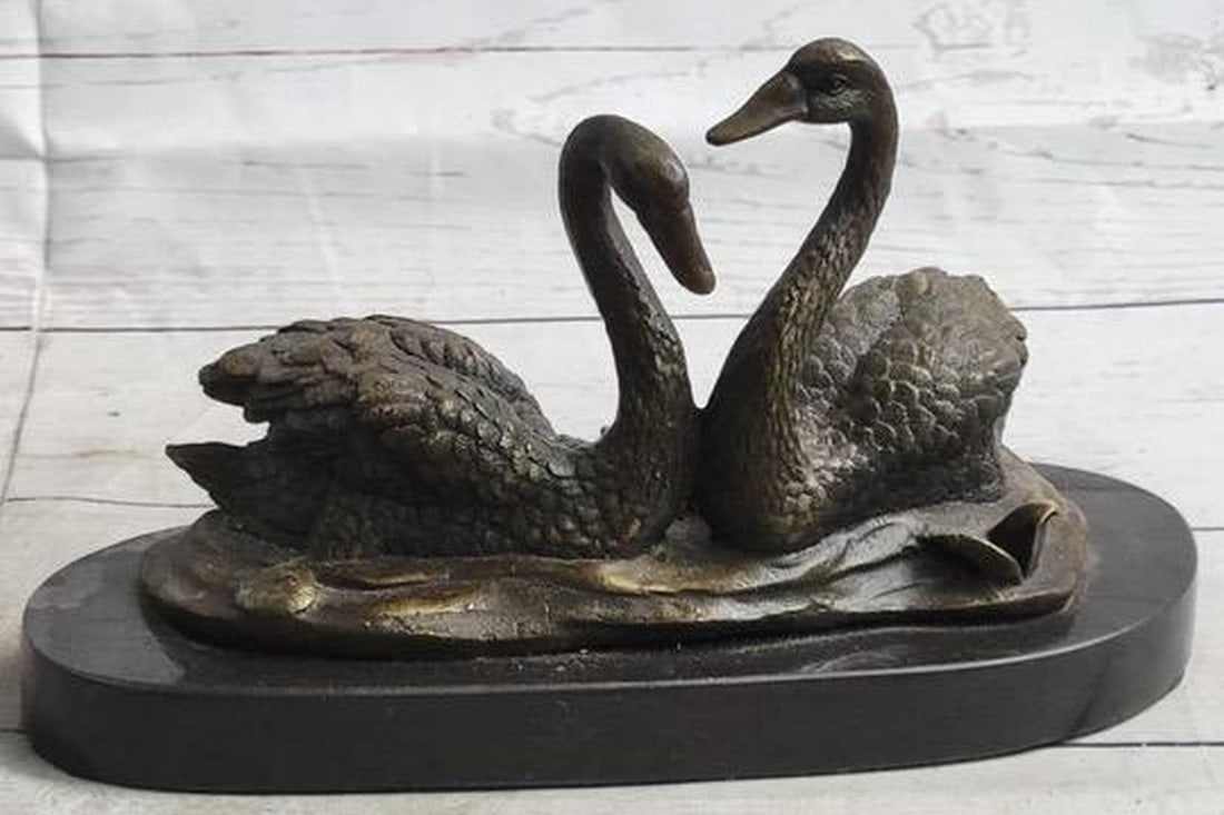 Swan Pair in Spring Original Bronze Statue - 6" x 9": Swan Pair in Spring Original Bronze Statue - 6" x 9" Immerse yourself in nature's tranquility with our captivating bronze sculpture featuring two swans gracefully gliding on water. Symboli