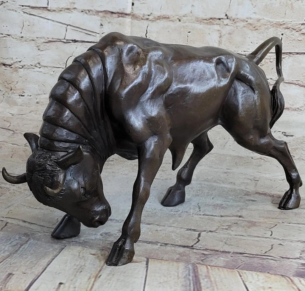 Fierce Bull Bronze Sculpture - 8" x 13": Fierce Bull Bronze Sculpture - 8" x 13" The male Bull trots along the grassy fields he calls home. His horns protrude out from the top of his head. The muscles in his body show through his ski