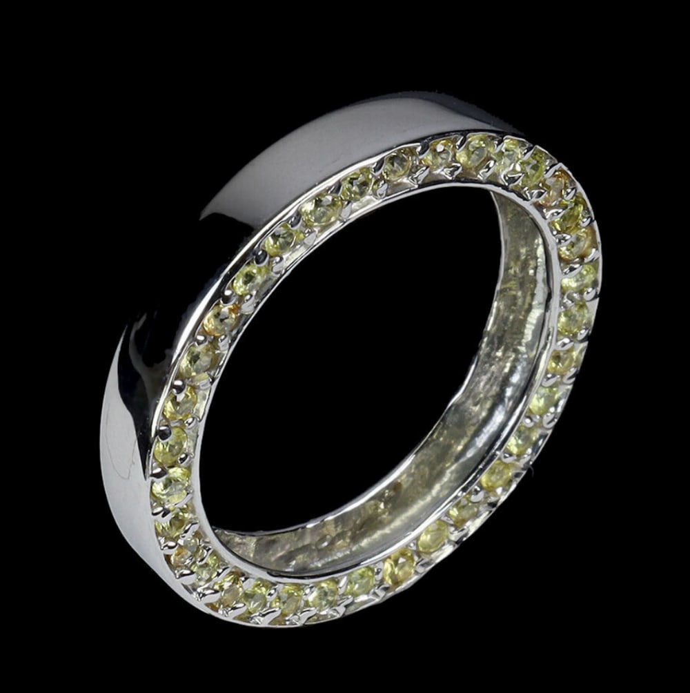 Soft Yellow Sapphire Band Ring - Size 7: Soft Yellow Sapphire Band Ring - Size 7 Set in lustrous sterling silver, the band of the ring is expertly crafted for both durability and comfort, ensuring a perfect fit for a size 7 finger. The sleek