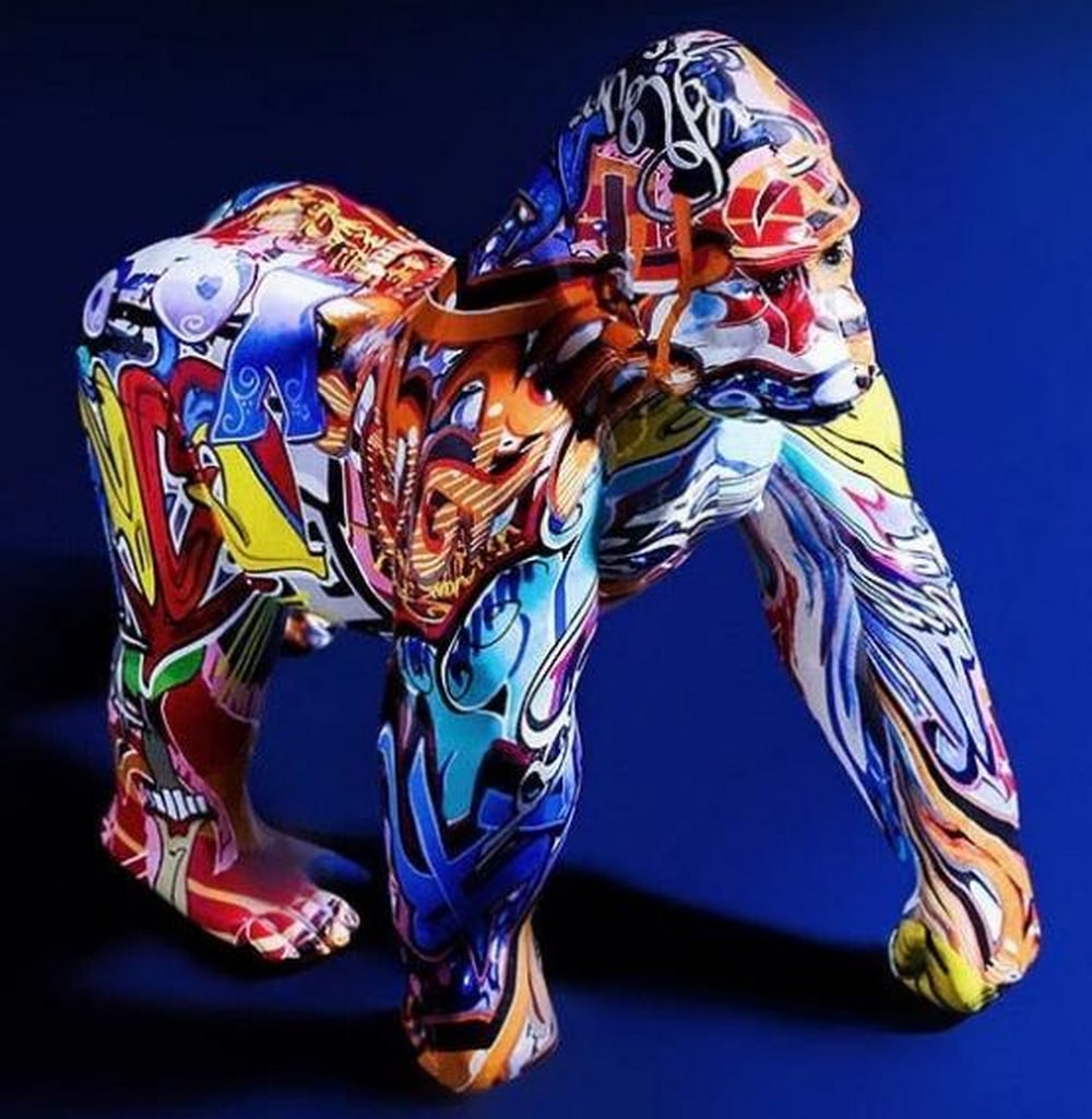 Graffiti Gorilla Resin Sculpture: Graffiti Gorilla Resin Sculpture Striking in presence and rich in detail, this high-quality resin sculpture captures the raw power of a standing gorilla, its posture strong, its expression intense. Wh