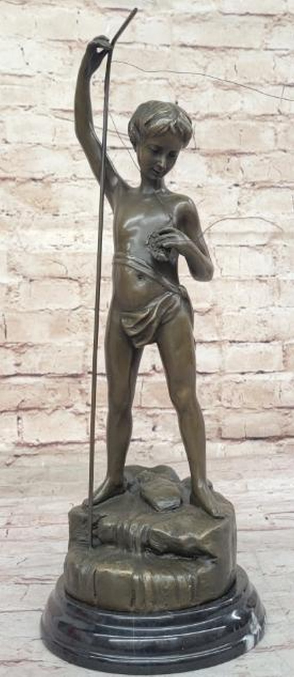 Bronze Sculpture of Boy Fishing: Bronze Sculpture of Boy Fishing Reproduction of and bearing the signature of artist A. Bofill, this bronze sculpture captures a timeless moment, a young boy eagerly pulling up his fishing line to see 