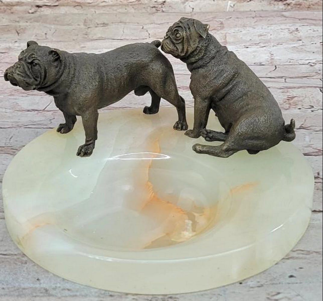 Bronze Bulldog Pair on Marble Soap Base: Bronze Bulldog Pair on Marble Soap Base Full of charm and personality, this bronze sculpture features two endearing bulldogs. One seated with a calm demeanor, the other standing attentively at its sid