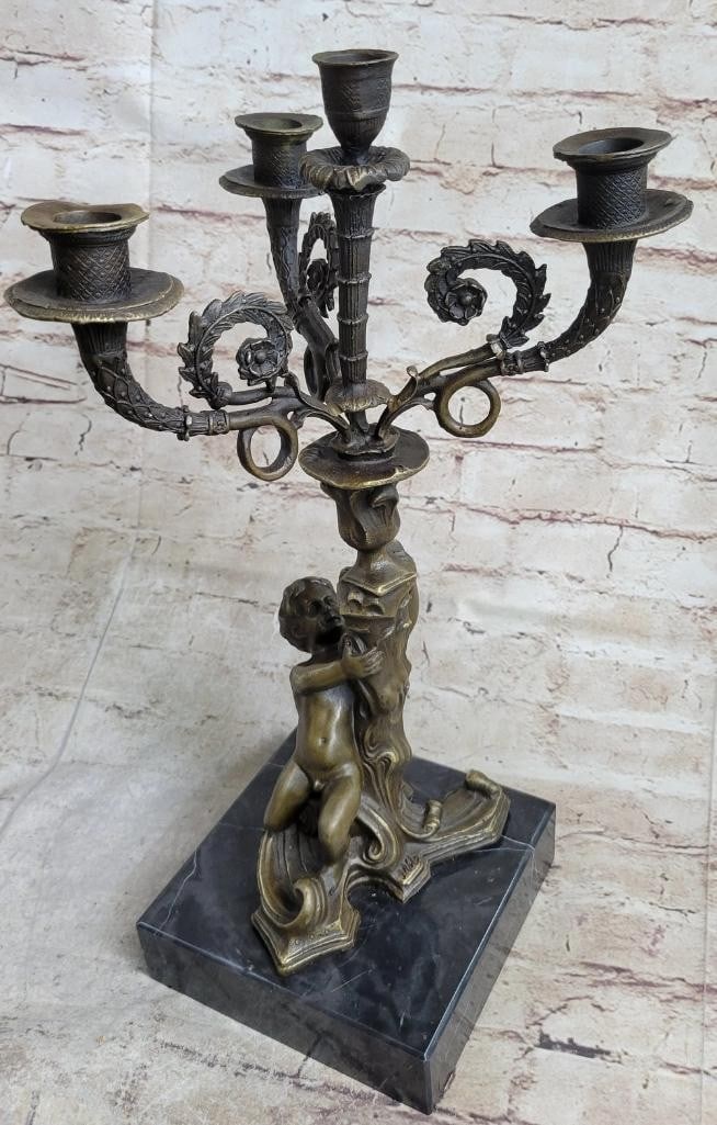 Hot Cast Bronze Cherubim Candelabra Sculpture by Milo - 16'' x 8'': Hot Cast Bronze Cherubim Candelabra Sculpture by Milo - 16x34 x 8x34 This finely detailed bronze sculpture features nude cherubim forming a candelabra, signed by Milo. Crafted using the lost wax casti