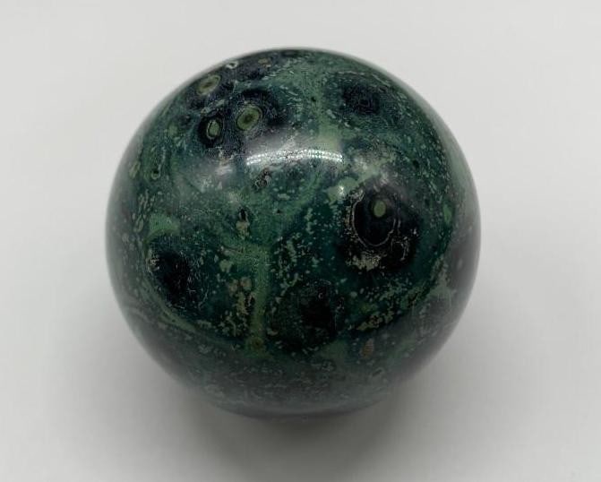 Natural Kabamba Jasper Crystal Sphere Kabamba Agate Mineral: Natural Kabamba Jasper Crystal Sphere Kabamba Agate Mineral. This is a striking mineral characterized by its deep green and black swirling patterns resembling natural landscapes. Renowned for its grou