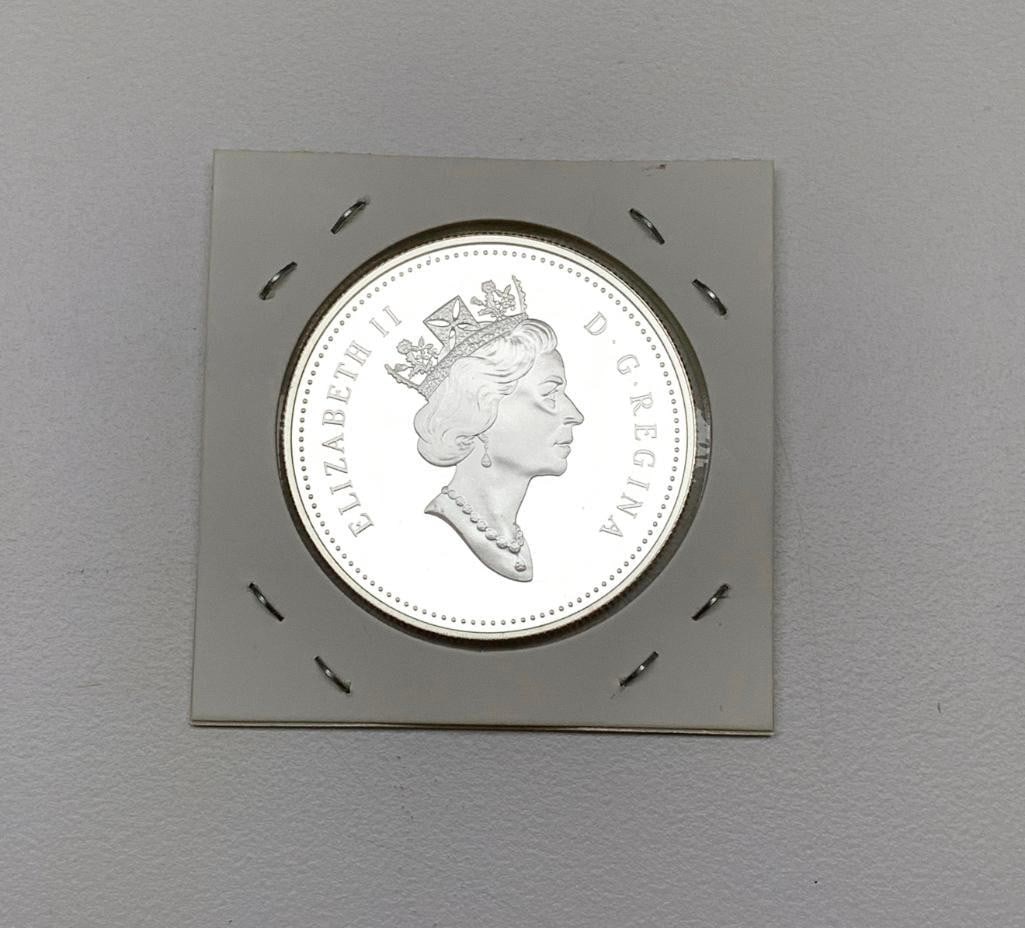 1 Dollar - Elizabeth II Juan Perez Expedition: Commemorative issue 225th Anniversary of the Voyage of Juan Perez (1999) Obverse Queen Elizabeth II Lettering: ELIZABETH II D?G?REGINA Engraver: Dora de Pedery-Hunt Reverse Canoes of the Ha