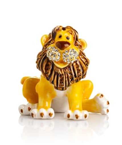 Lion Trinket Box: Lion Trinket Box This enamel-painted trinket box is beautifully decorated with handpicked Austrian crystals, each artistically placed to create a stunning design. Plated with either 24K gold or 925 si