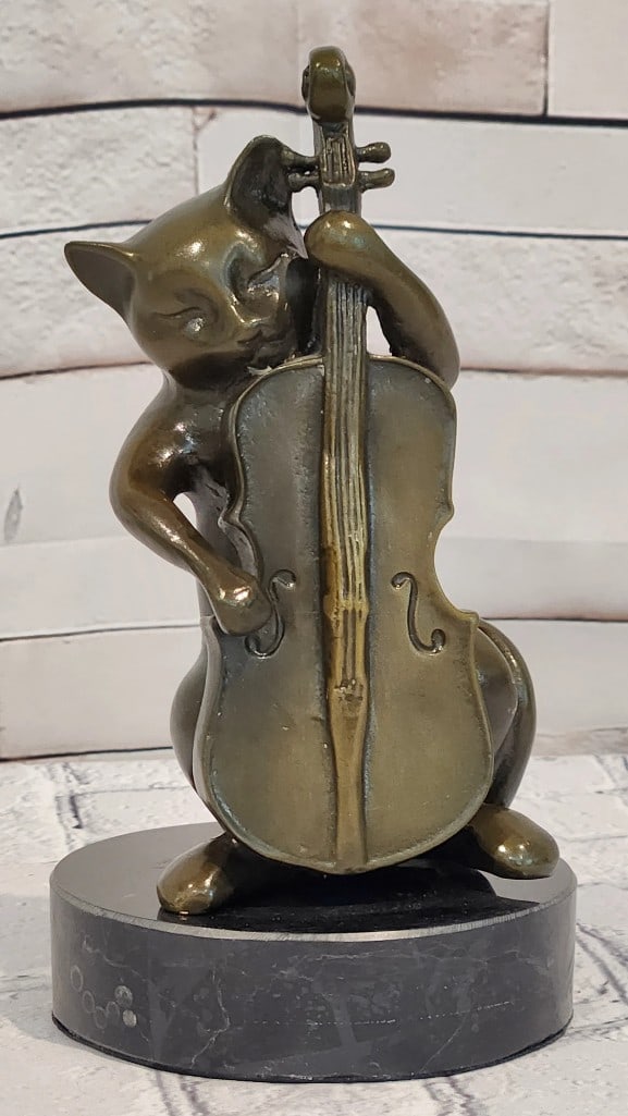 Harmony in Bronze - Cat Playing Cello Musician Sculpture: Harmony in Bronze - Cat Playing Cello Musician Sculpture Harmony in Bronze is a charming and whimsical sculpture that captures a graceful cat immersed in the art of music, delicately playing a cello. 