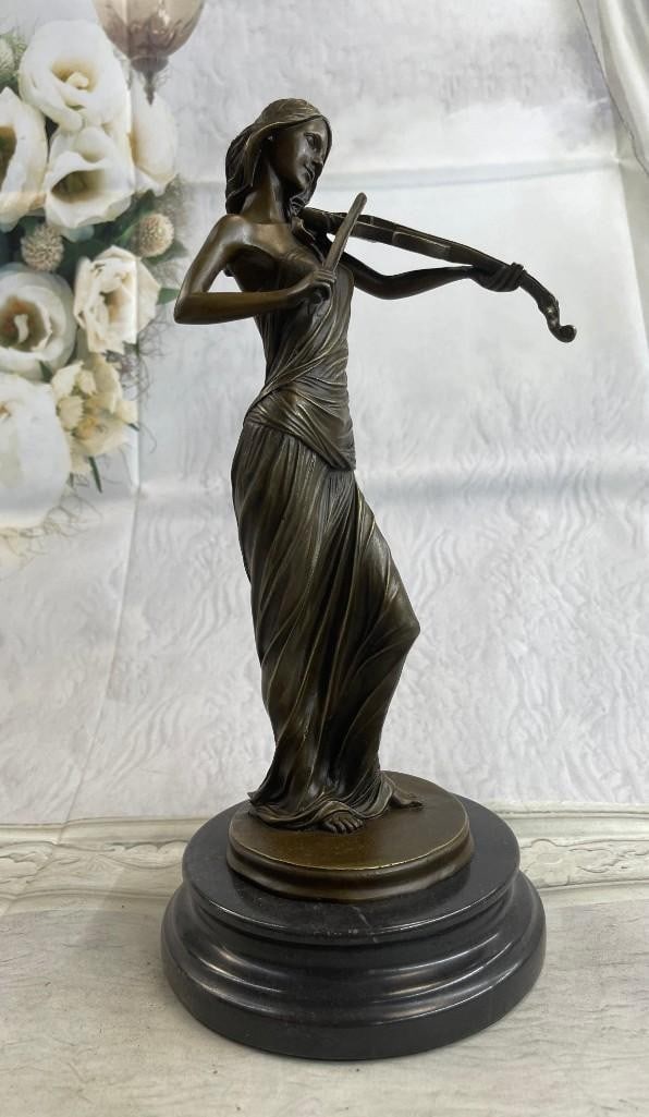 Female Violinist Bronze Statue (Brown Patina Colouring): Female Violinist Bronze Statue (Brown Patina Colouring). Peacefully entranced by her musical gift, this woman plays her violin. Her eyes are closed as she moves the bow back and forth creating beautif