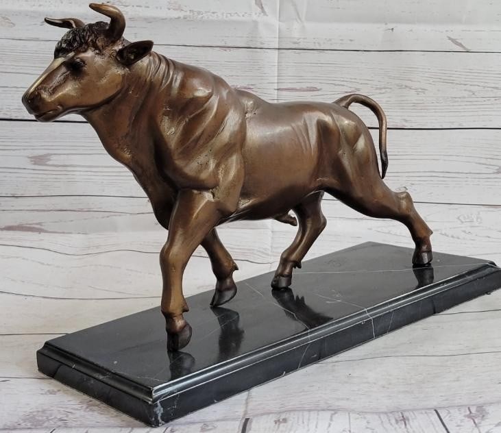 Charging Bull Bronze Sculpture On A Black Marble Base