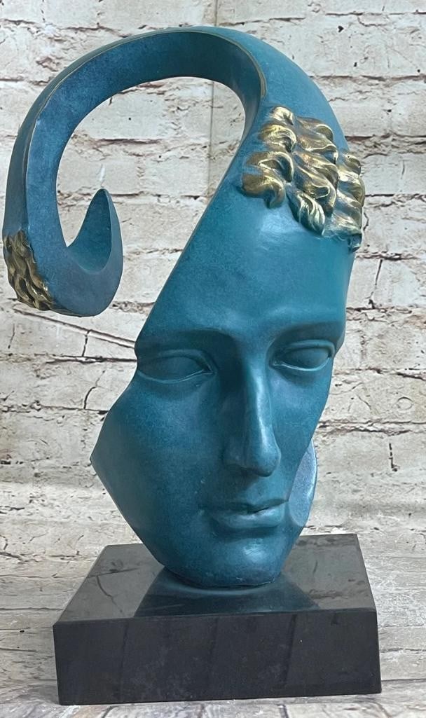 Salvador Dali Patina Integrated Face Bronze Sculpture - 13'' x 7'': Salvador Dali Patina Integrated Face Bronze Sculpture - 13x34 x 7x34 Salvador Dali integrated a face into a strip made of bronze. It is well-proportioned and very symmetrical. The face reminds of the 