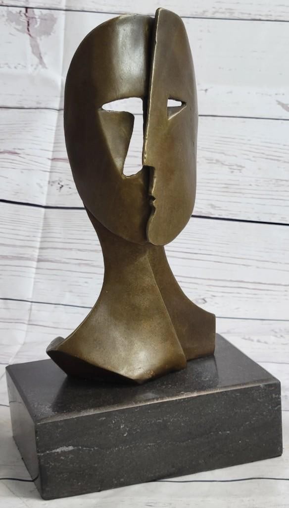 Two Masked Faces Bronze Sculpture: Two Masked Faces Bronze Sculpture Woman and Man - the sun on the right represents the woman, the slither of a moon on the left the man. I use the mythical language of fairy tales, yet years after its 