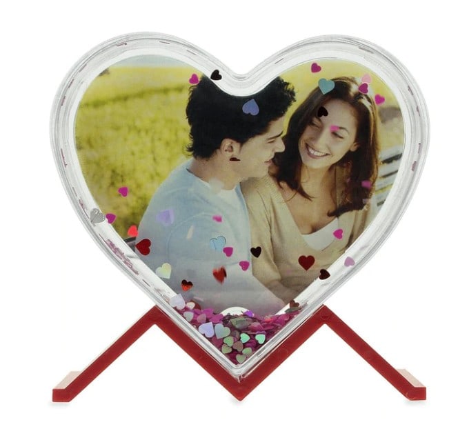 Heart Shape Clear Acrylic Plastic Water Globe Picture Frame: Heart Shape Clear Acrylic Plastic Water Globe Picture Frame. -Acrylic Plastic Globe -You Can Replace Picture with your Own -Contains Sparkling Pink and Silver Hearts Dimensions: 3.9 Inches Tall x 4
