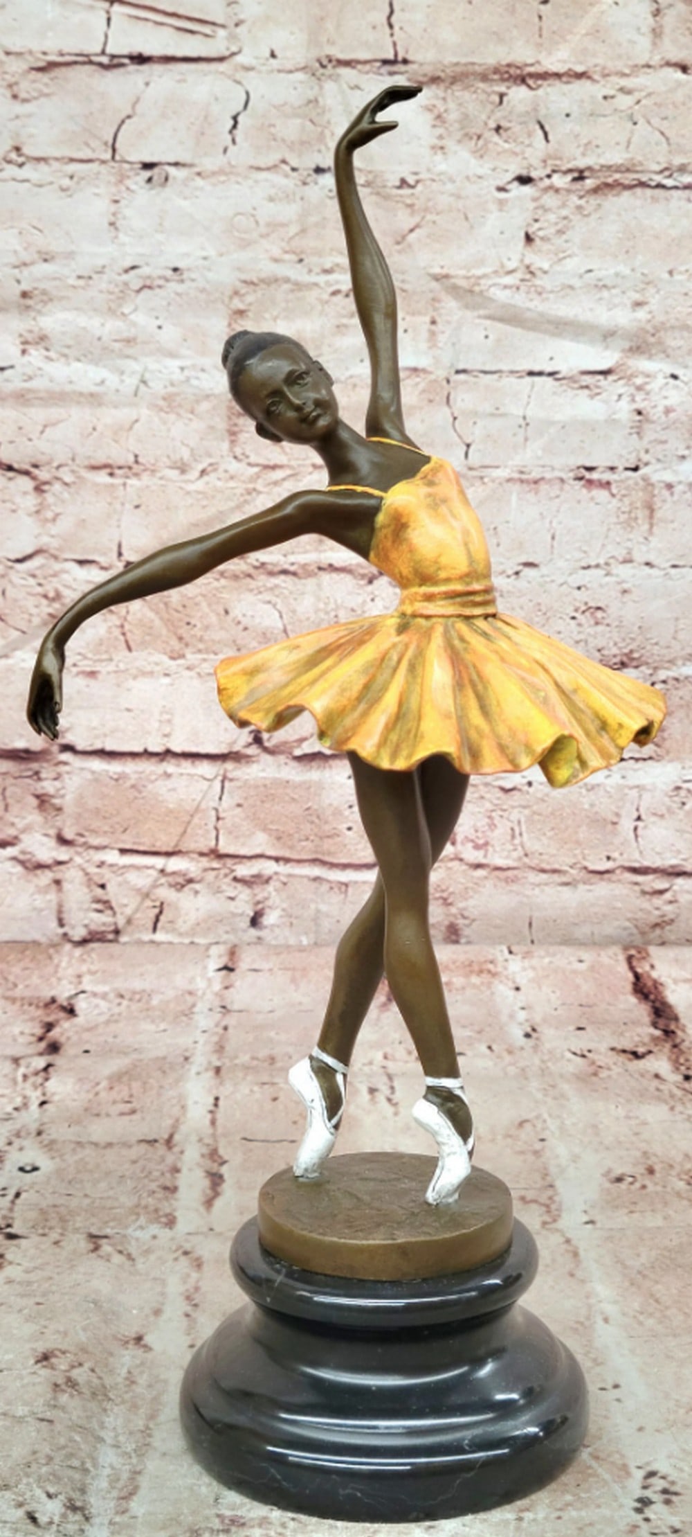 Ballerina Bronze Sculpture in Yellow Tutu on Marble Base - 13'' x 7'': Ballerina Bronze Sculpture in Yellow Tutu on Marble Base - 13" x 7" This original bronze sculpture captures the elegance and grace of a ballerina performing in a vibrant yellow tutu. With a po