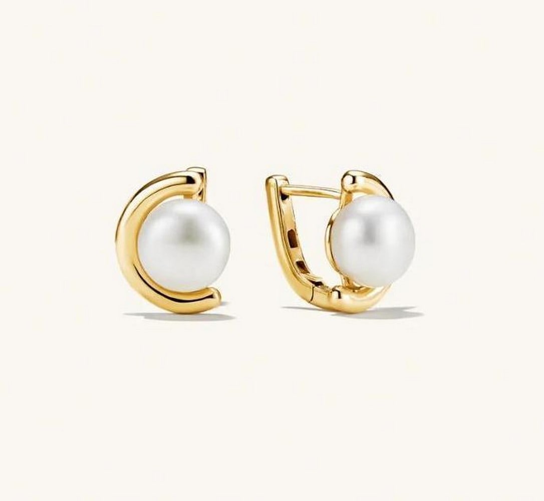 18k Gold Vermeil Celestial Pearl Drops: 18k Gold Vermeil Celestial Pearl Drops Celestial Pearl Drops embody timeless elegance with their lustrous pearls suspended delicately from gleaming gold accents. Each earring captures the soft glow