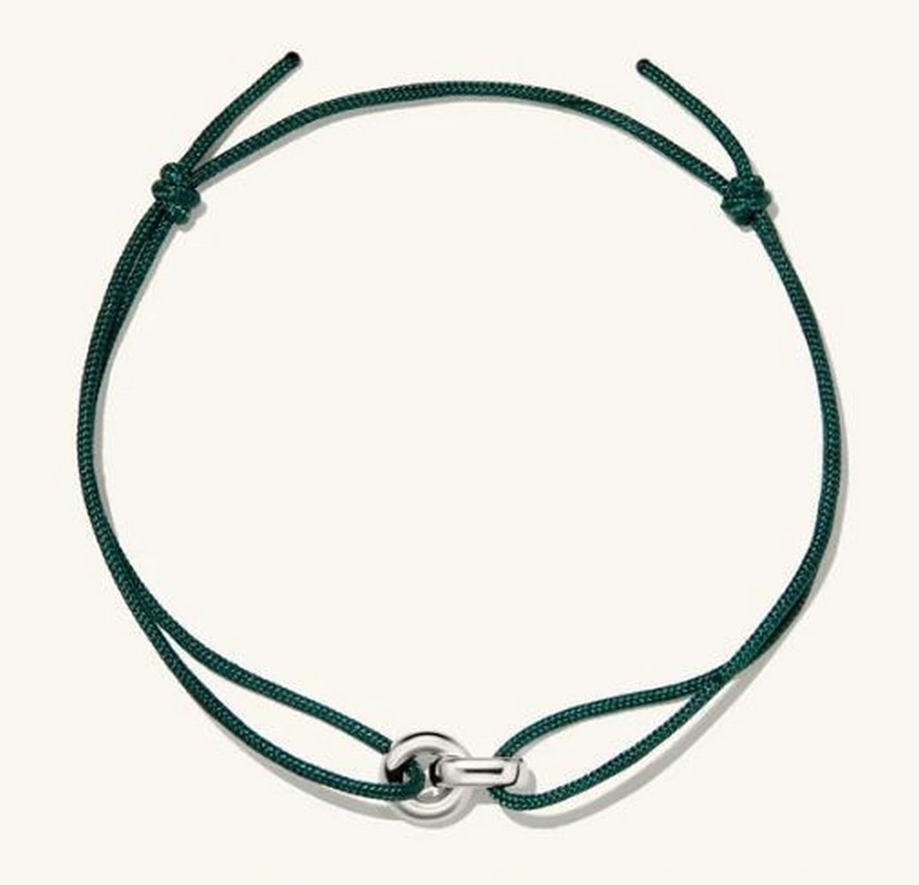 Sterling Silver Green Vine Bracelet: Sterling Silver Green Vine Bracelet This bracelet is a stunning fusion of elegance and nature, featuring intricately crafted sterling silver pieces woven together with a rich green cord. This