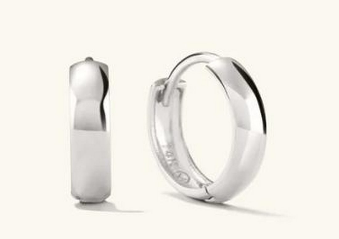 14K White Gold Hoop Earrings: 14K White Gold Hoop Earrings. Crafted from 14K white gold, these hoops have a sleek, polished finish that radiates a sophisticated, cool-toned luster. Their classic design features a smooth, continuou