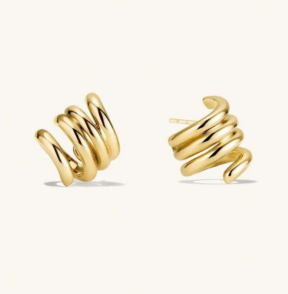 Infinity Coils Gold Vermeil Earrings: Infinity Coils Gold Vermeil Earrings With its distinctive coil design, this earring strikes the perfect balance - effortlessly cool without trying too hard. Bold yet playful, it shines solo as a state