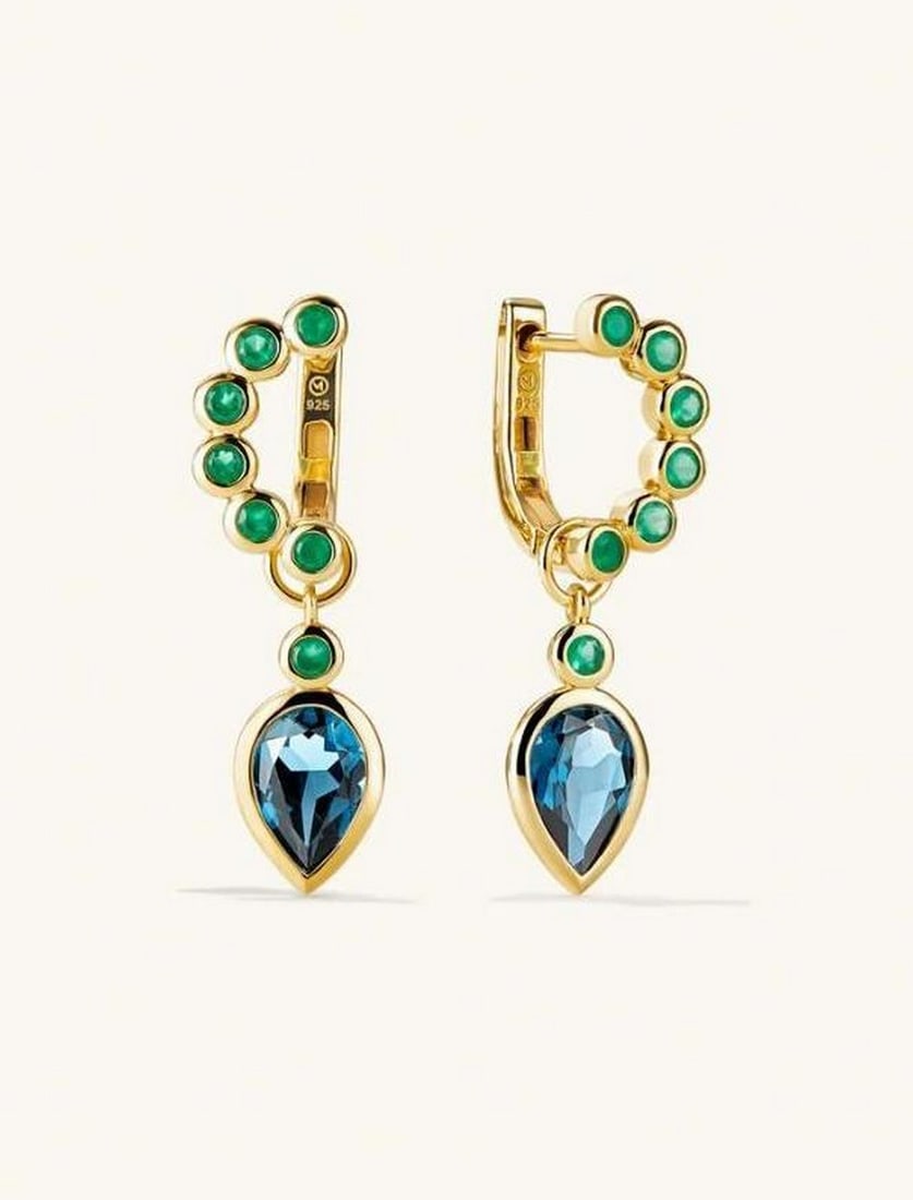 Gold Vermeil Facet Drop Hoops: Gold Vermeil Facet Drop Hoops The Gold Vermeil Facet Drop Hoops are set to be the new star of your jewelry collection. These C-shaped earrings, encrusted with gemstones, come with a removable pearl ch