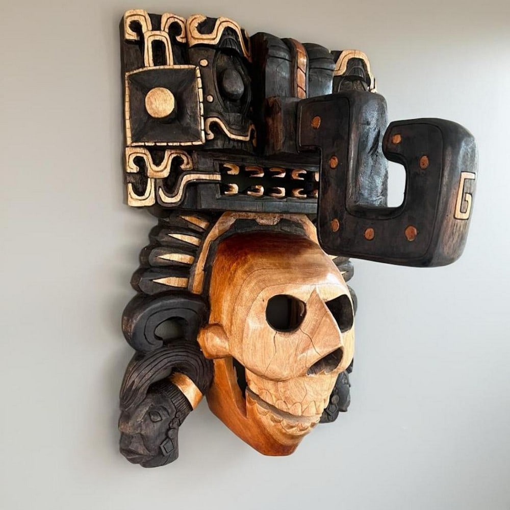 Chaac Carrier Hand-Carved Cedar Mask: Chaac Carrier Hand-Carved Cedar Mask This hand-carved wooden mask depicts Chaac in a carrier-style design inspired by Mayan traditions and pre-Hispanic art. The piece features detailed carving and dim