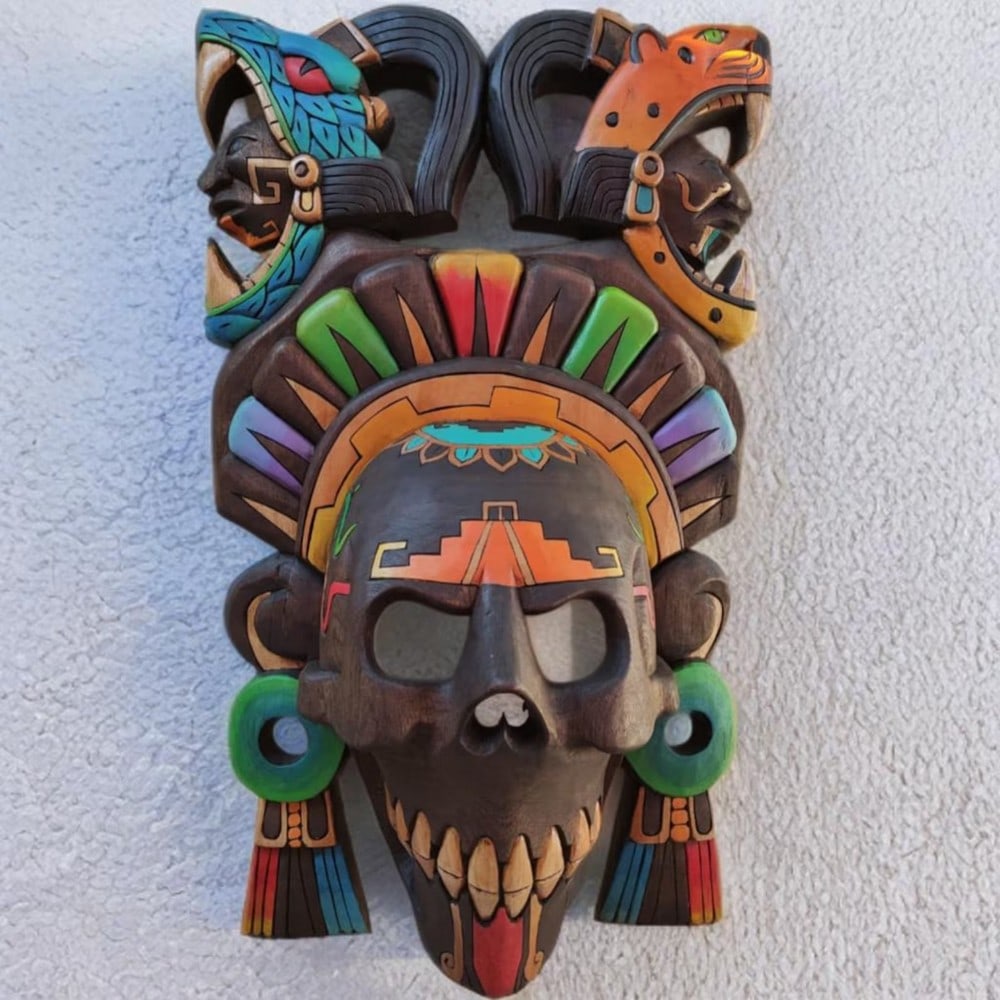 Hand Carved Mayan Quetzalcoatl Mask: Hand Carved Mayan Quetzalcoatl Mask This striking mask is a captivating work of art, its vibrant colors drawing the viewer in and sparking curiosity about its deeper meaning. Like many Mayan and Aztec