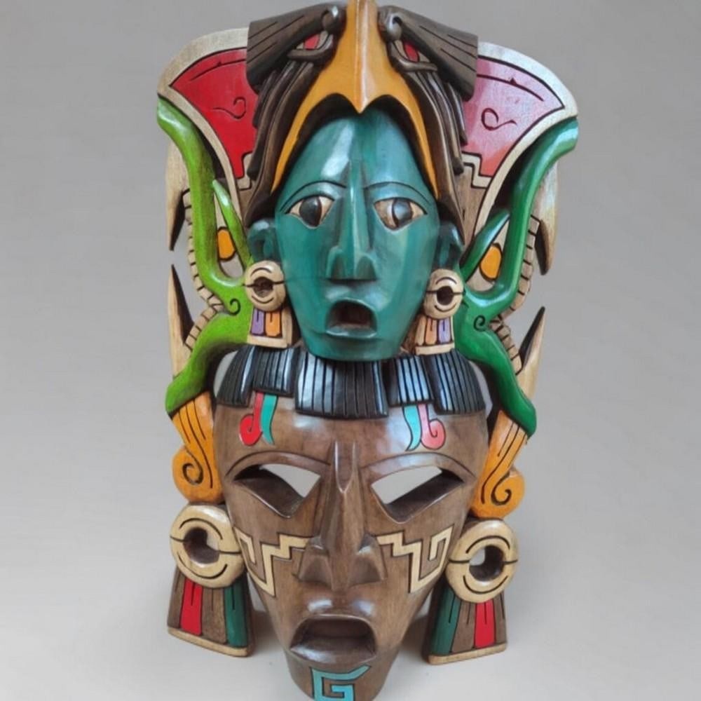 Hand Carved Mayan Spirit Mask: Hand Carved Mayan Spirit Mask This striking mask is perfect for any home, bar, or restaurant decor. Its vibrant tropical colors and expertly crafted 3D carving immediately capture attention, making it