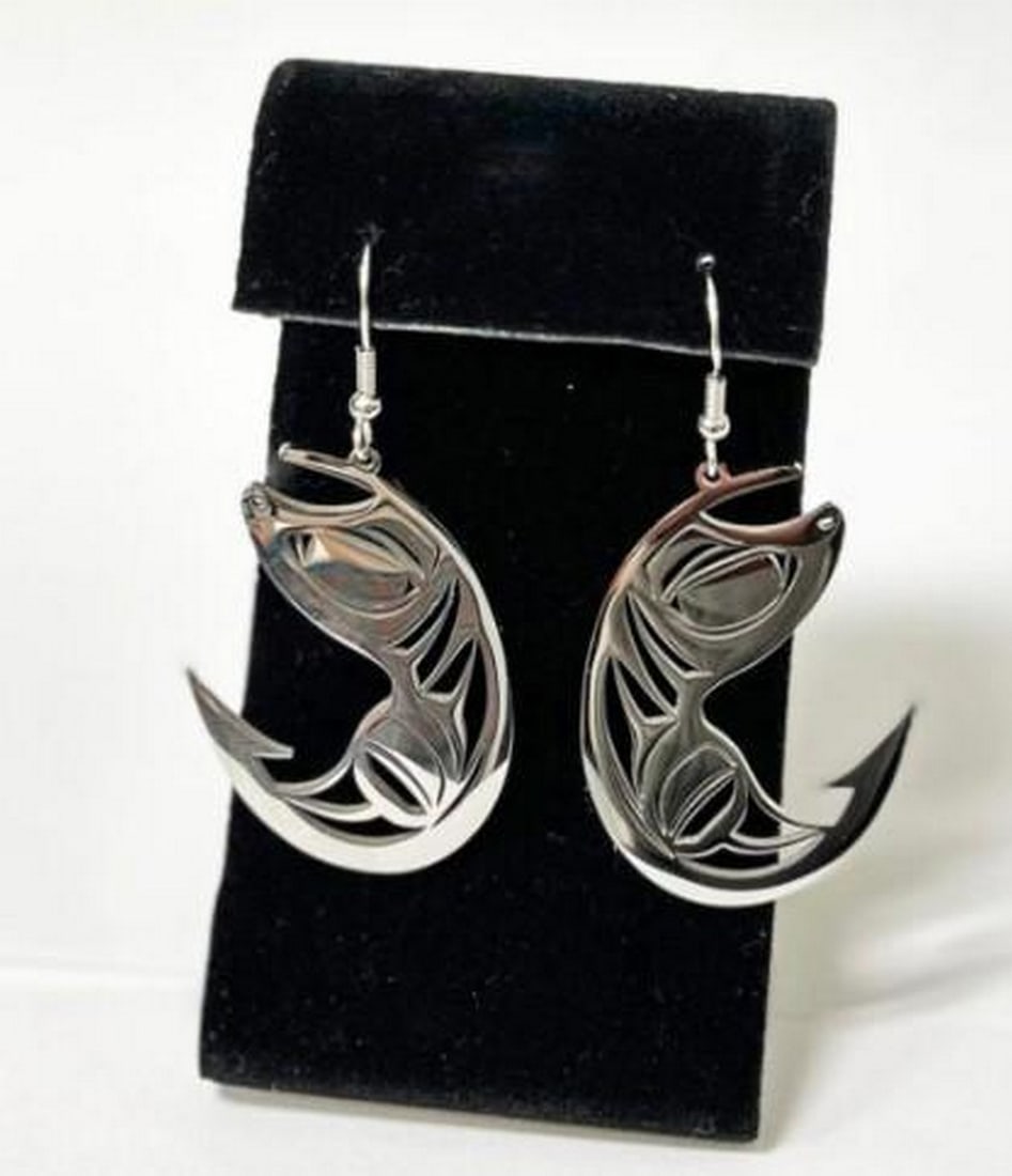 Salmon Run Earrings: Salmon Run Earrings The Salmon Run Earrings celebrate the strength and determination of the legendary salmon. Crafted from durable stainless steel, these sleek hook-style earrings pay tribute to the