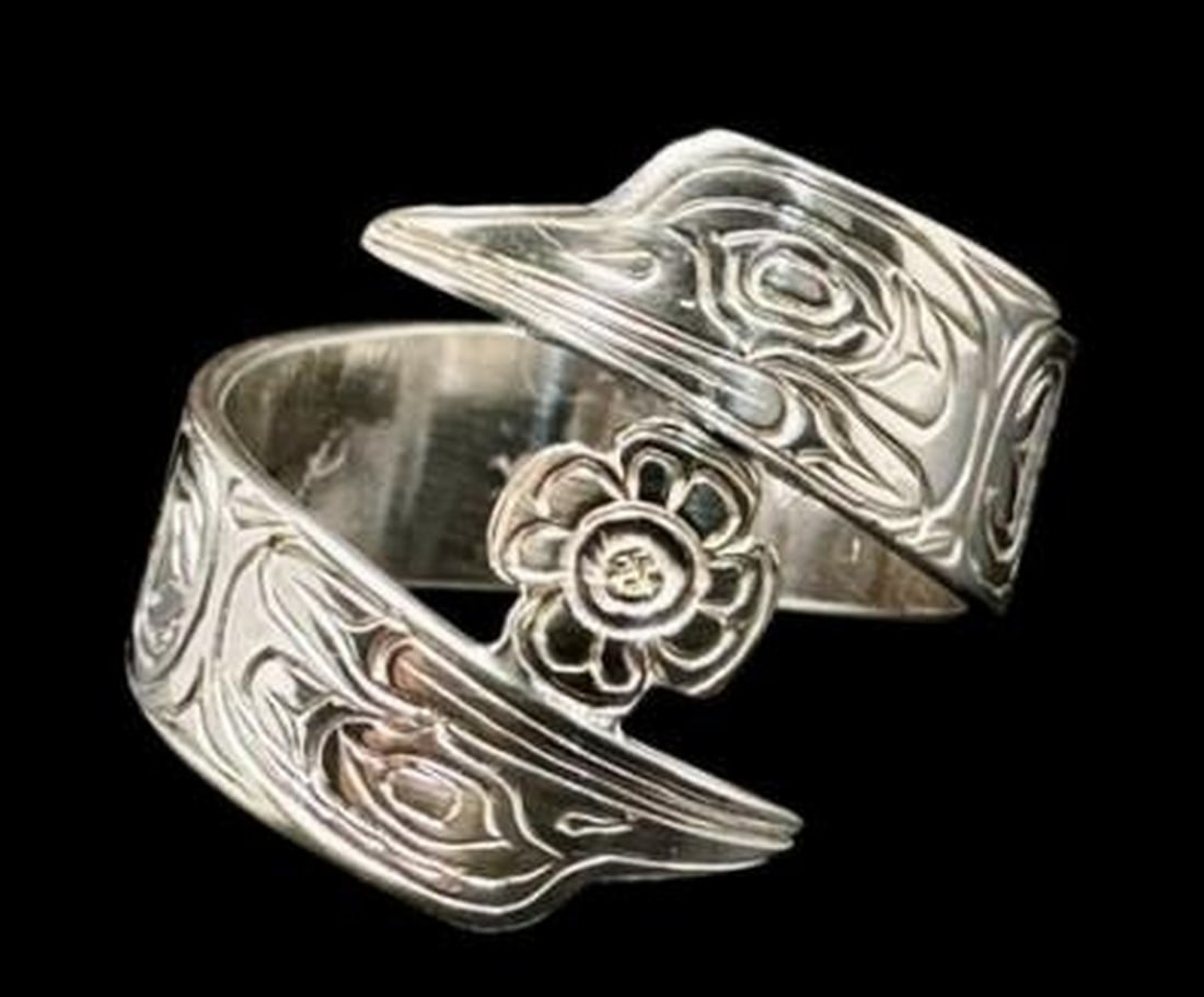 Hummingbird Harmony Wrap Ring: Hummingbird Harmony Wrap Ring The Hummingbird Harmony wrap ring captures the grace and energy of nature's tiniest marvel. Crafted in luminous white gold, this elegant design features a delicately