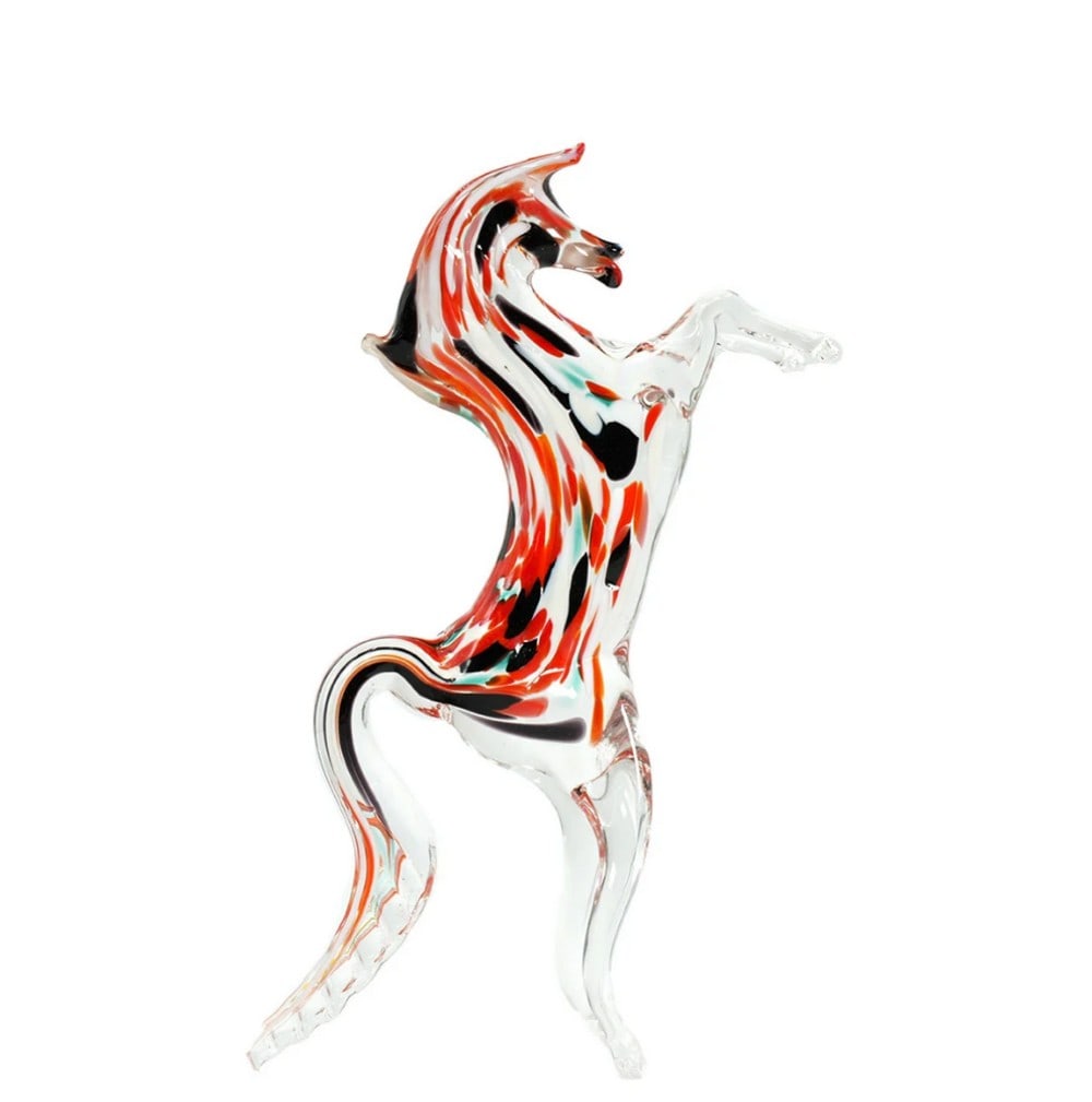 Prancing Horse Murano Glass Sculpture: Prancing Horse Murano Glass Sculpture Introducing the Prancing Horse Murano Glass Sculpture, a handcrafted piece made with traditional warm glass techniques. This sculpture depicts a horse in motion, 