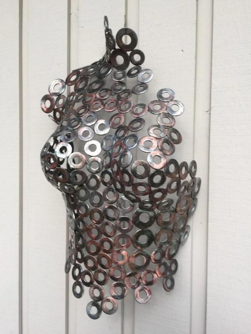Cassady Metal Torso Sculpture: Cassady Metal Torso Sculpture This striking female torso sculpture, Cassady, blends abstract form and intricate metalwork to create a sensual, timeless piece of art. Hand-formed and welded, each detai