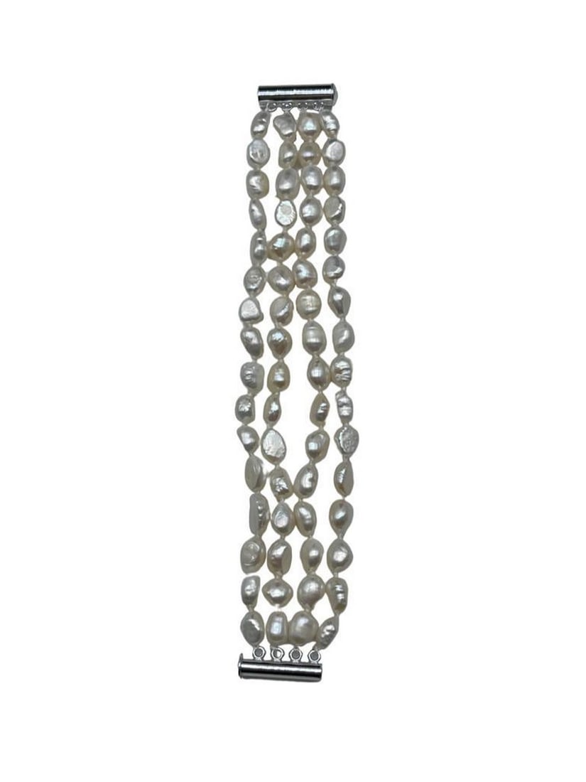 Natural White Baroque 4-Strand Freshwater Pearl Bracelet: Natural White Baroque 4-Strand Freshwater Pearl Bracelet. Natural Silver Glimmers Come Off Each Of The 7-8mm Pearls. There are 60+ Pearls On This 4 Strand Bracelet and Is Accompanied By A Push Tub