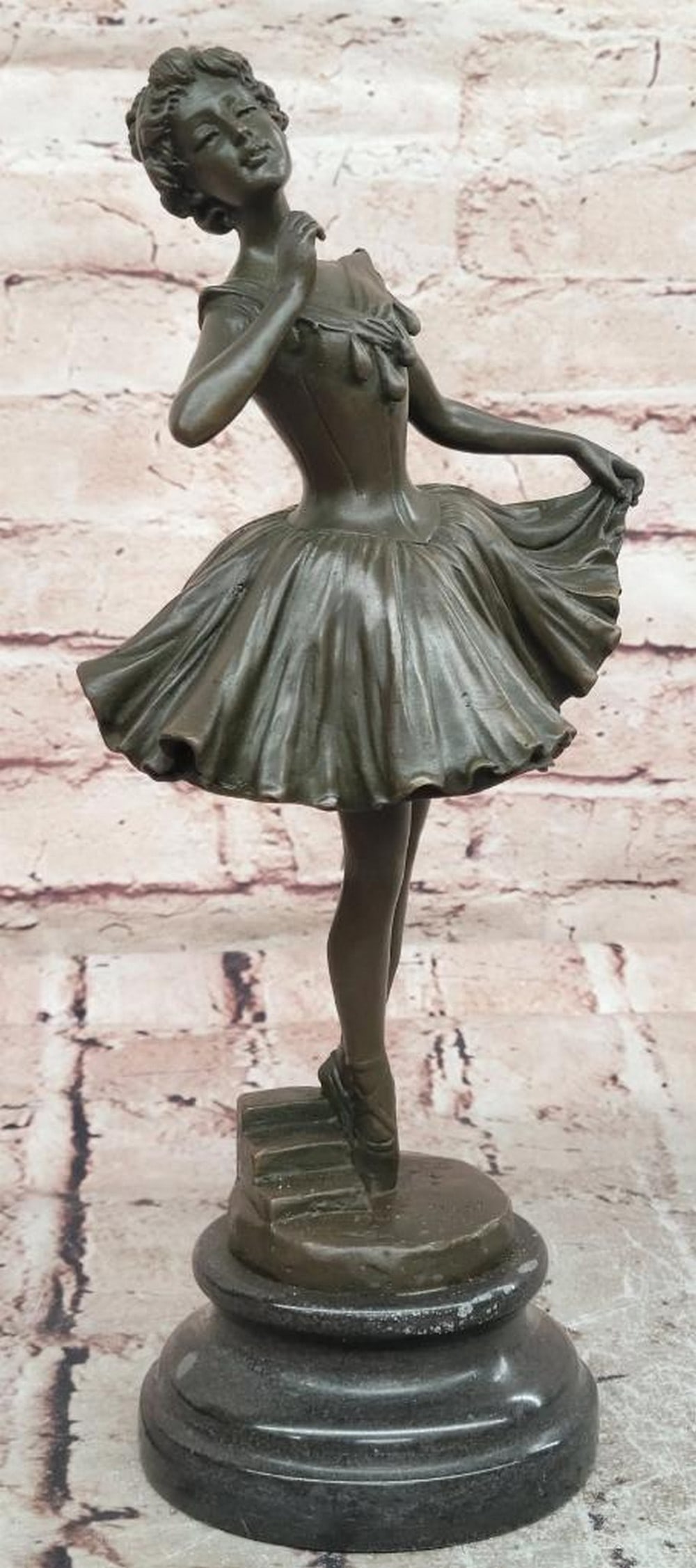 Degas Inspired Bronze Ballerina Sculpture - 12'' x 5.5'': Degas Inspired Bronze Ballerina Sculpture - 12" x 5.5" This original bronze sculpture depicts a graceful ballerina in a poised moment of dance, inspired by Edgar Degas. The figure reflects ele