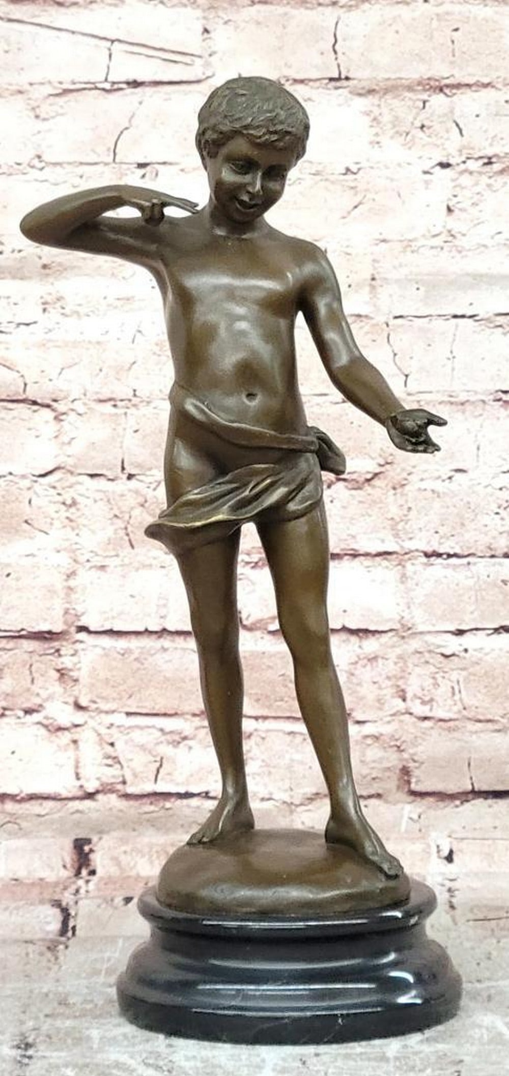 Somme Bronze Boy with Snail Sculpture - 15.5'' x 8.5'': Somme Bronze Boy with Snail Sculpture - 15.5" x 8.5" This original bronze sculpture depicts a young boy gently holding a snail, capturing a quiet moment of curiosity and childhood innocence. T