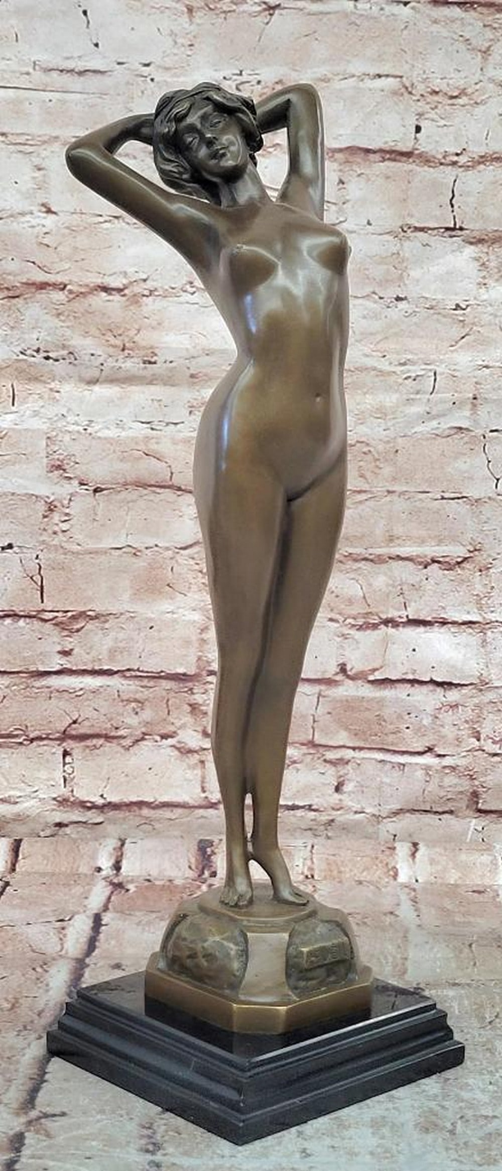 Le Reveil Bronze Female Figure Sculpture - 17'' x 5'': Le Reveil Bronze Female Figure Sculpture - 17" x 5" This inspired bronze sculpture titled 'Le Reveil' ('The Awakening') depicts a graceful female figure emerging from repose, symbolizing renew